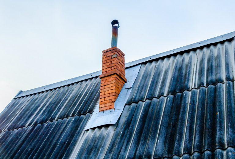 An Old House With A Slate Roof And A Brick