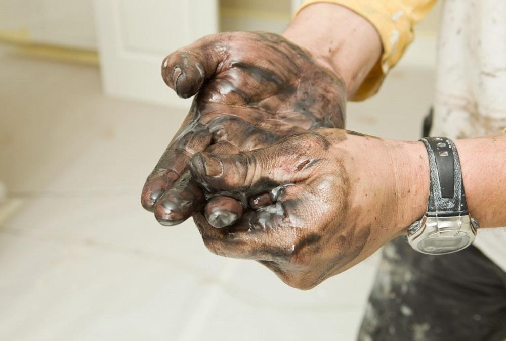Painter Washing Stained Hands with Lacquer Thinner
